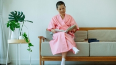 An elderly person reading a book