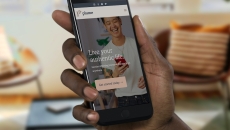 A closeup of a hand holding a smartphone displaying the Plume app. A closeup of a hand holding a smartphone displaying the Plume app.