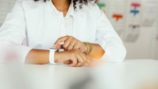 A woman using a smartwatch A woman using a smartwatch