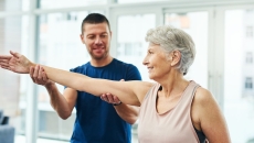 Two people stretching together