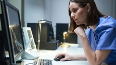 Healthcare provider sitting at a computer