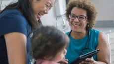 Healthcare provider with a patient and their caregiver