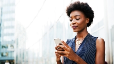 A woman using her smartphone. A woman using her smartphone.