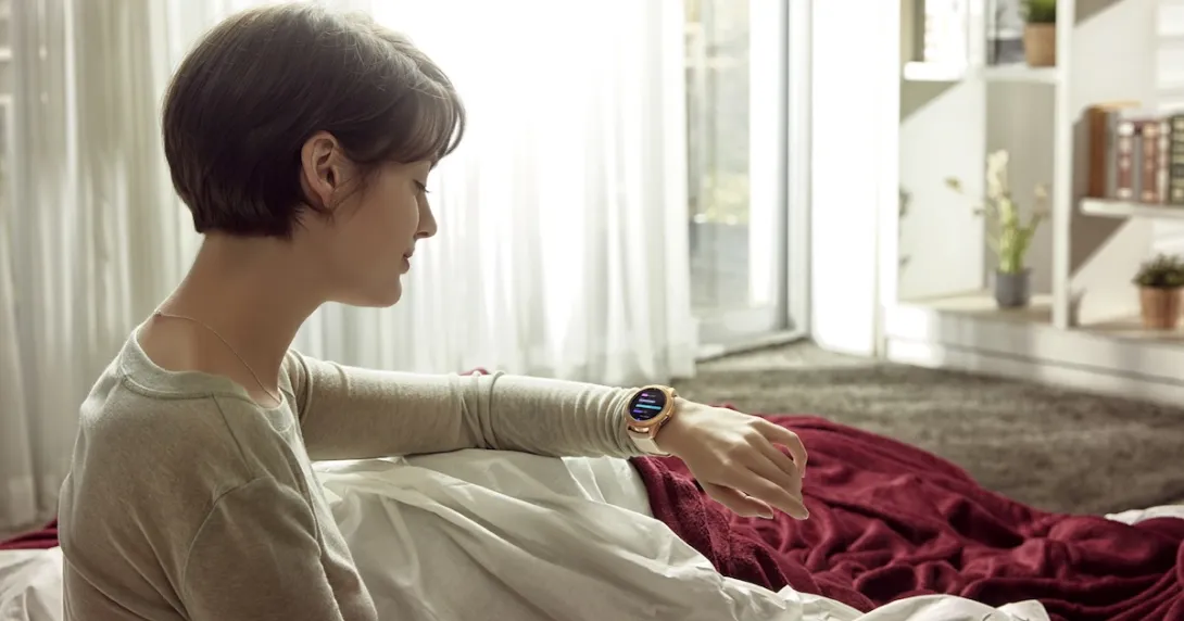 Person looking at their smart watch Person looking at their smart watch