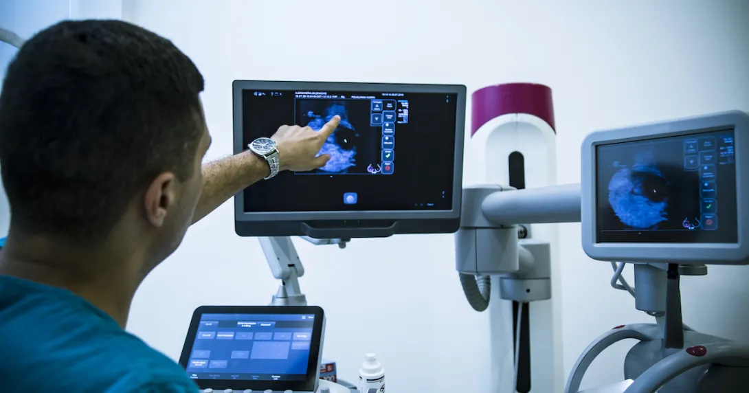 Healthcare provider reviewing a scanned image on a screen Healthcare provider reviewing a scanned image on a screen