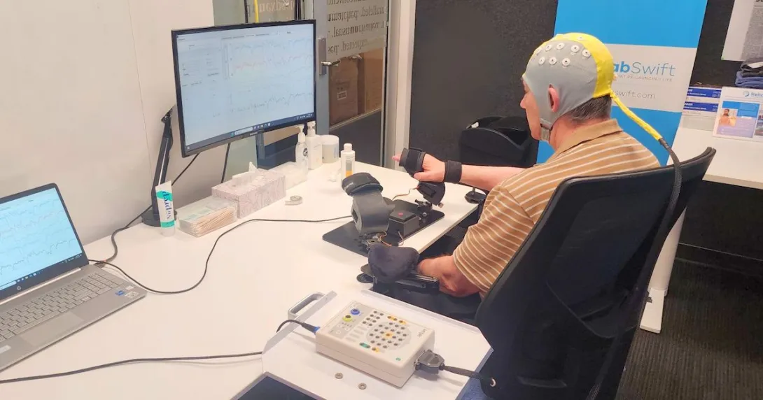 A post-stroke patient receiving brain-computer interface-based rehabilitation therapy A post-stroke patient receiving brain-computer interface-based rehabilitation therapy