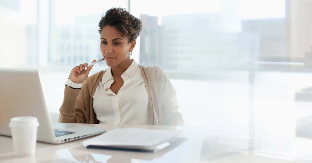 Person sitting at a desk Person sitting at a desk
