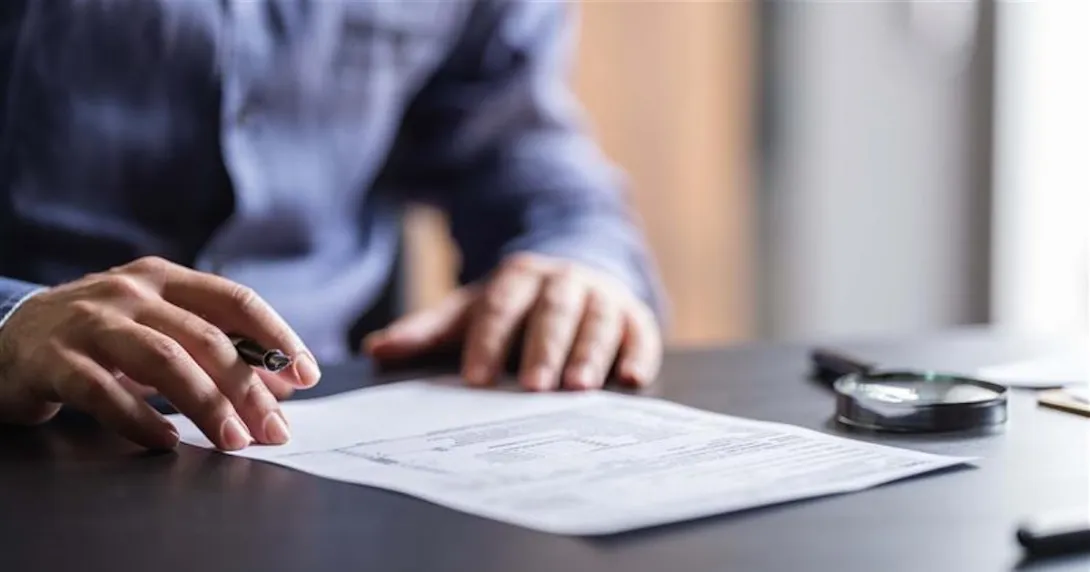 Person signing a contract Person signing a contract