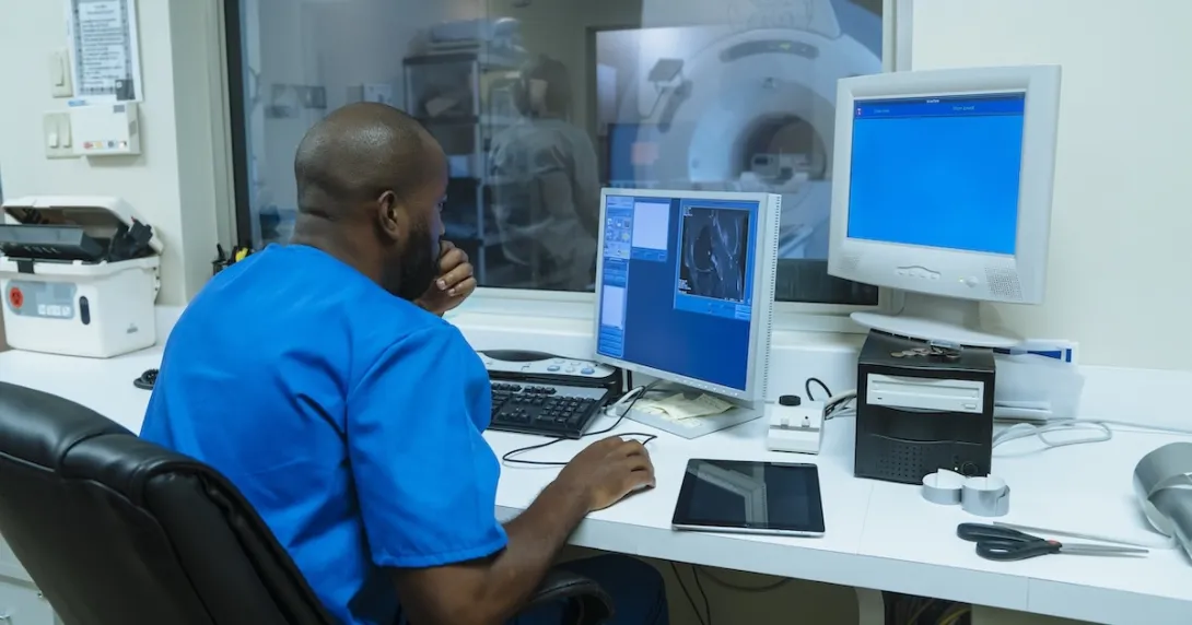 Healthcare professional looking at MRI data Healthcare professional looking at MRI data