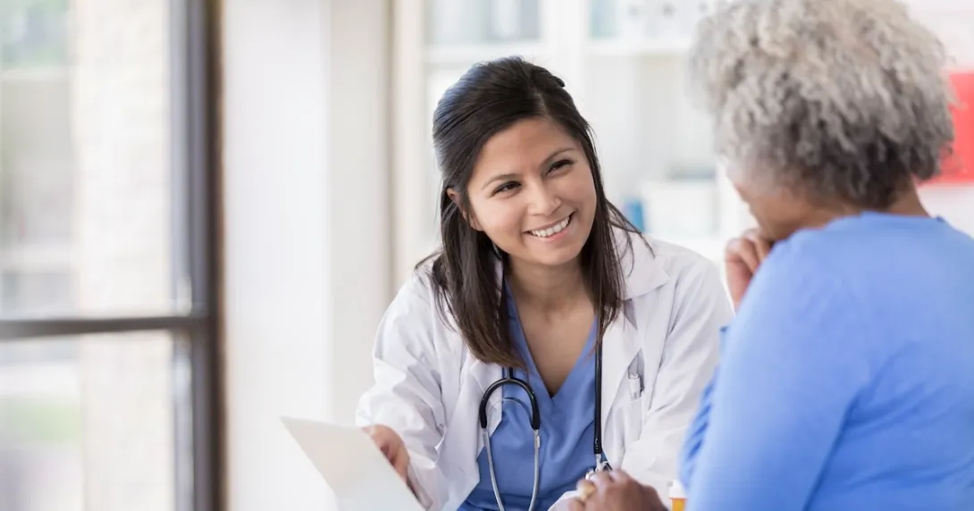 Healthcare professional consulting with a patient 