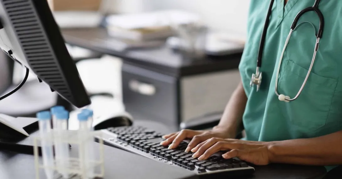 Nurse working at a computer Nurse working at a computer