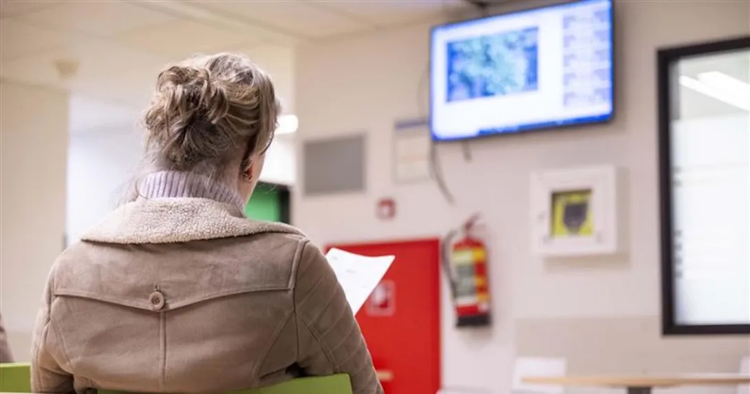 Person waiting in a waiting room Person waiting in a waiting room