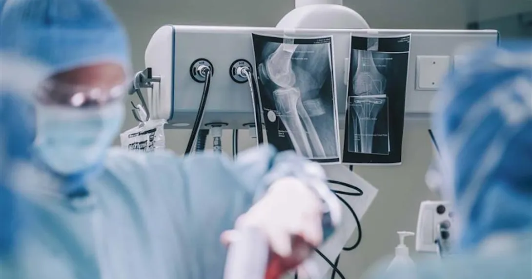 Surgeons doing operation in hospital operating room Surgeons doing operation in hospital operating room