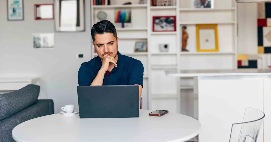 Person working on a laptop from home