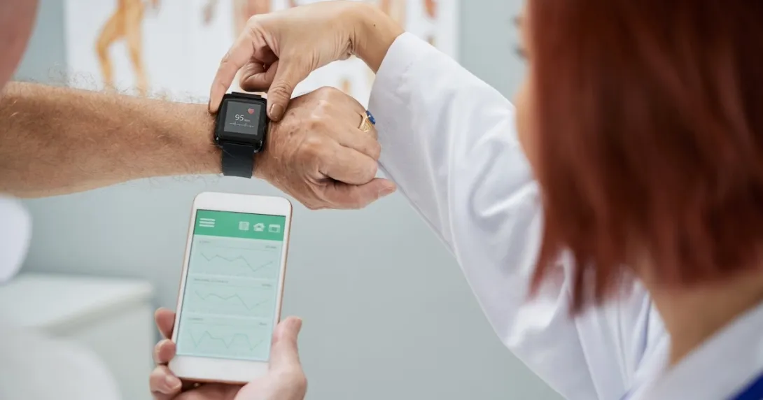 Healthcare professional explaining smart watch and smart phone link Healthcare professional explaining smart watch and smart phone link