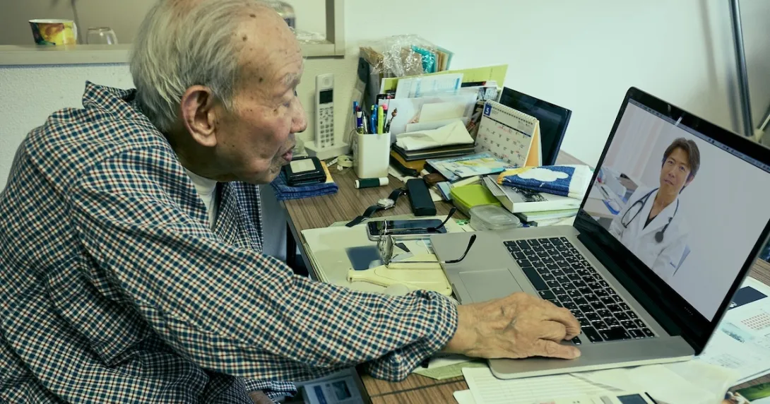 Senior adult consulting with healthcare professional via laptop computer Senior adult consulting with healthcare professional via laptop computer