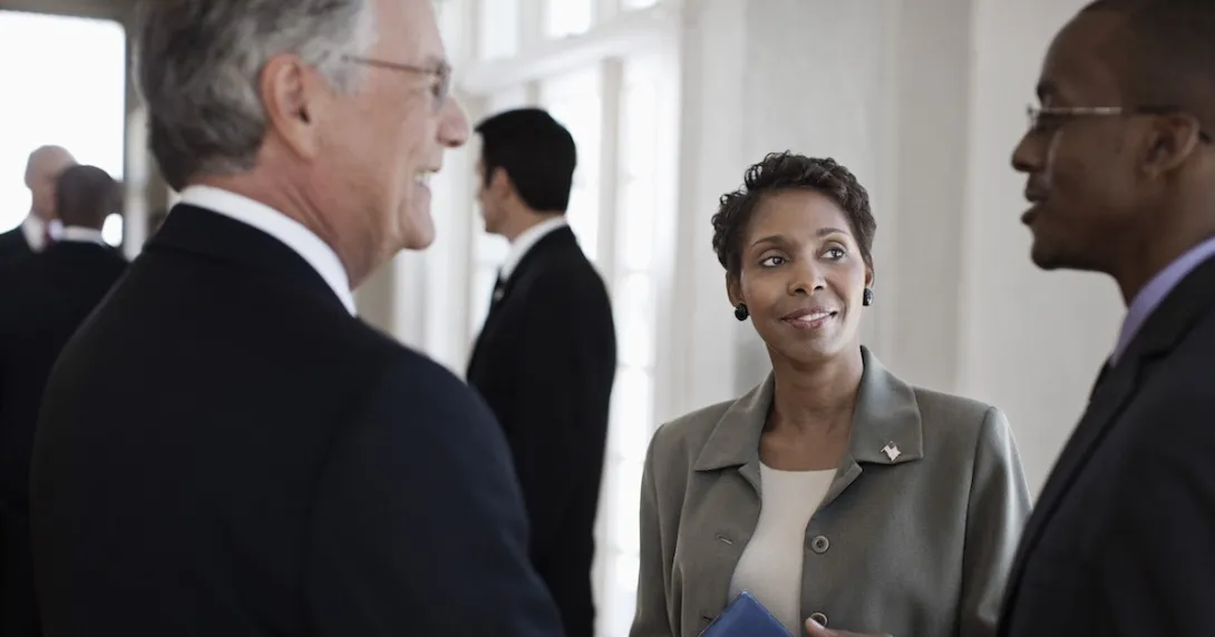 Executives conferring Executives conferring