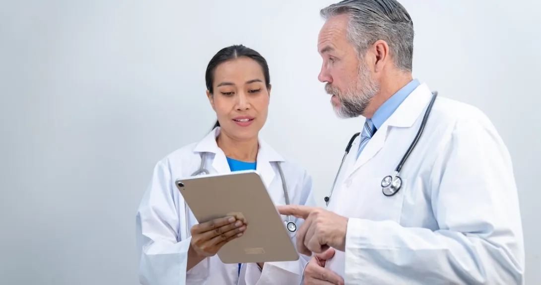 Clinicians reviewing patient record Clinicians reviewing patient record