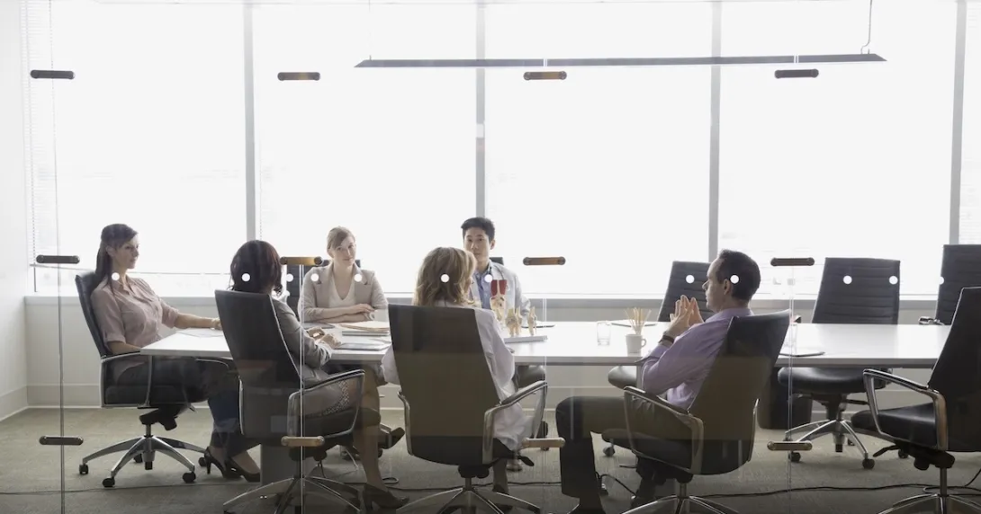 Executives meeting in a conference room Executives meeting in a conference room