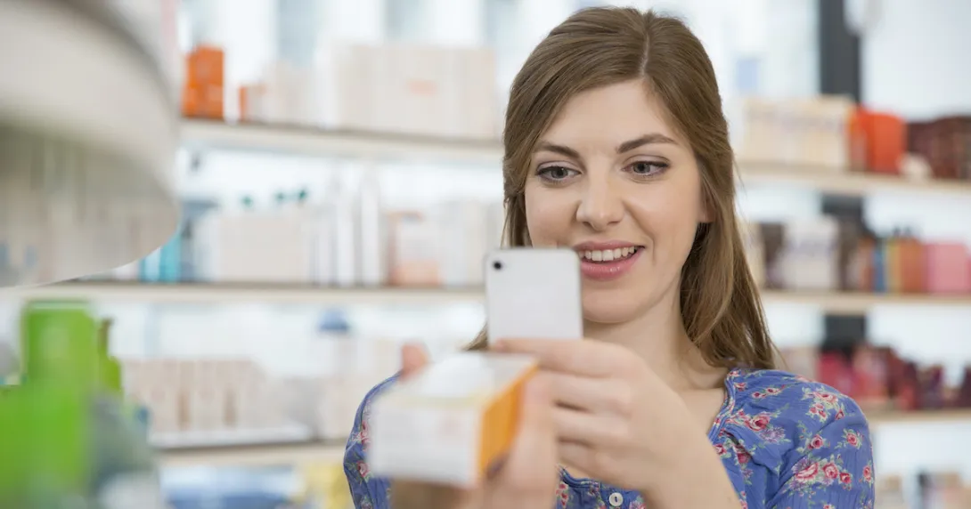 Person taking a picture of a medication box