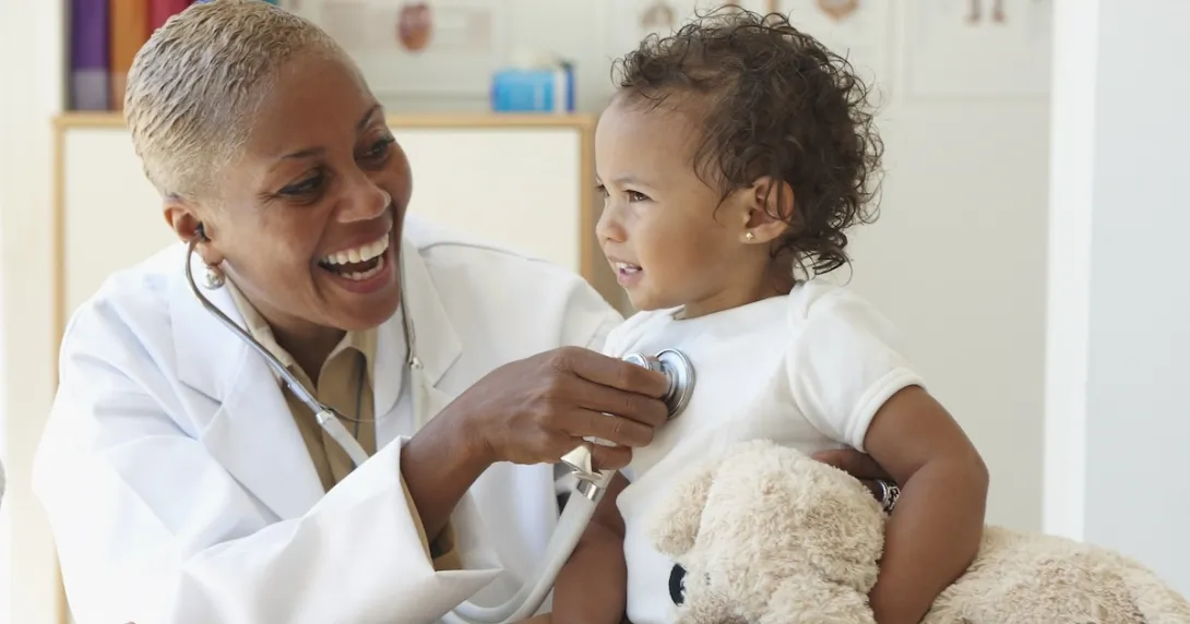 Healthcare professional with infant Healthcare professional with infant