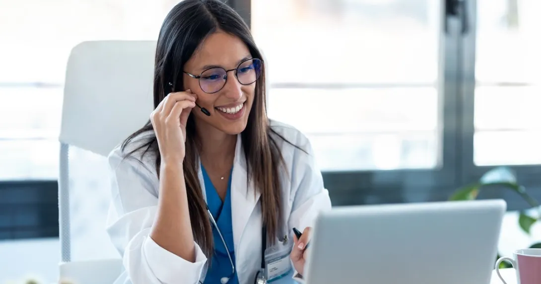 Healthcare professional interacting with a person via a PC Healthcare professional interacting with a person via a PC