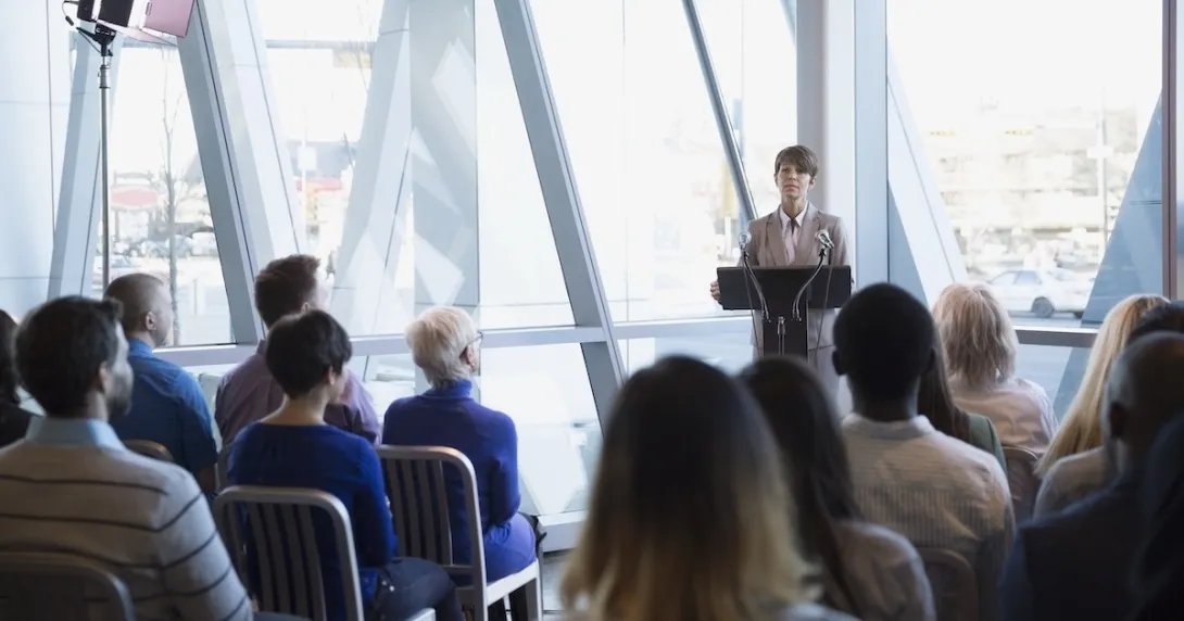 Person addressing business meeting Person addressing business meeting