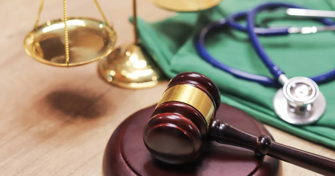 A gavel and a stethoscope. A gavel and a stethoscope.