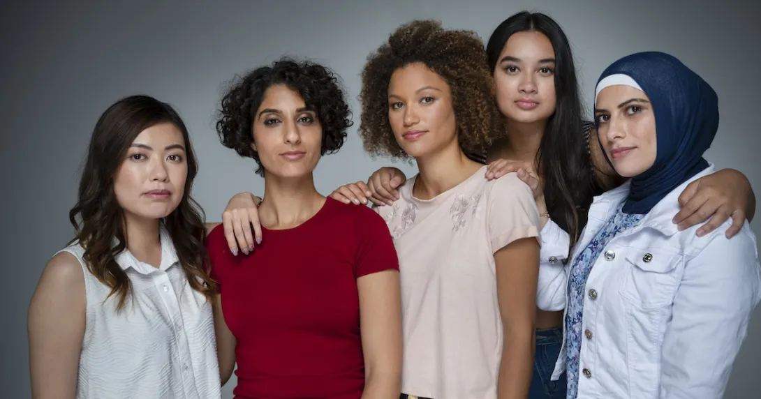 Five people standing in a group looking at the camera Five people standing in a group looking at the camera