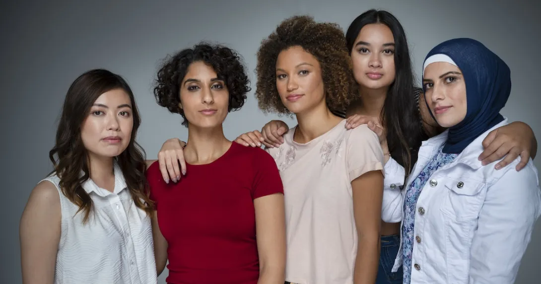 Five people standing by each other Five people standing by each other