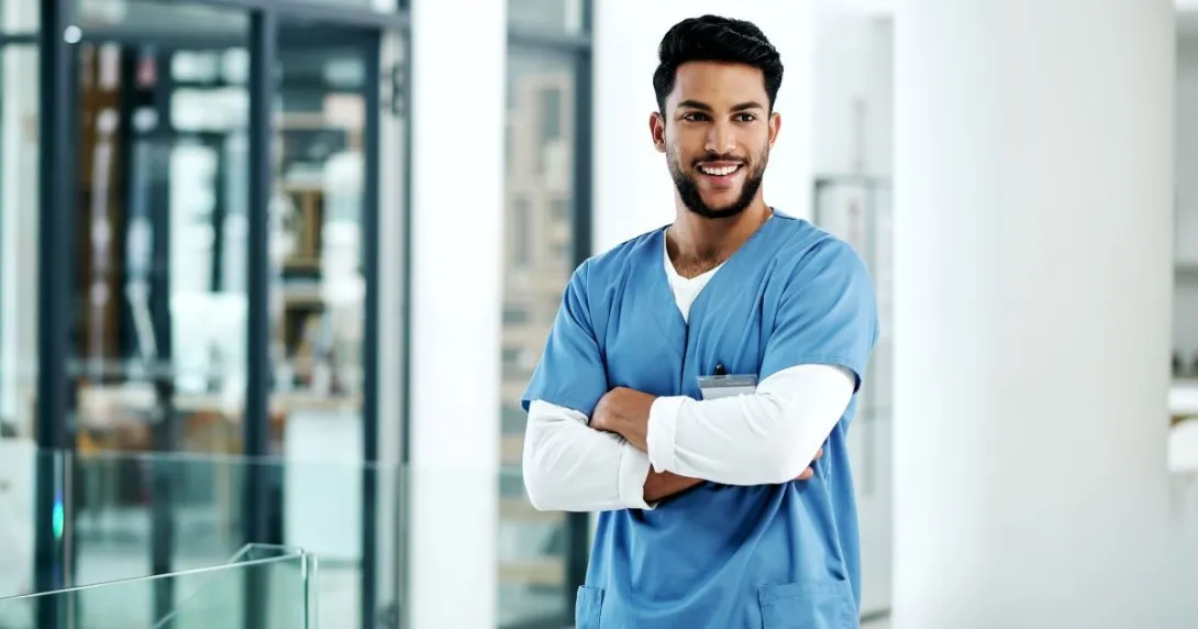 Person standing with arms crossed Person standing with arms crossed
