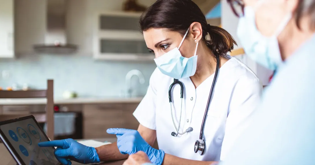 Two people looking at a tablet Two people looking at a tablet