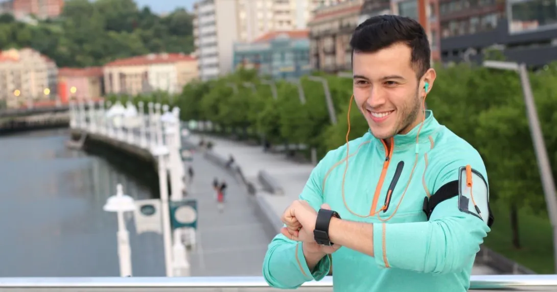 person using digital watch person using digital watch