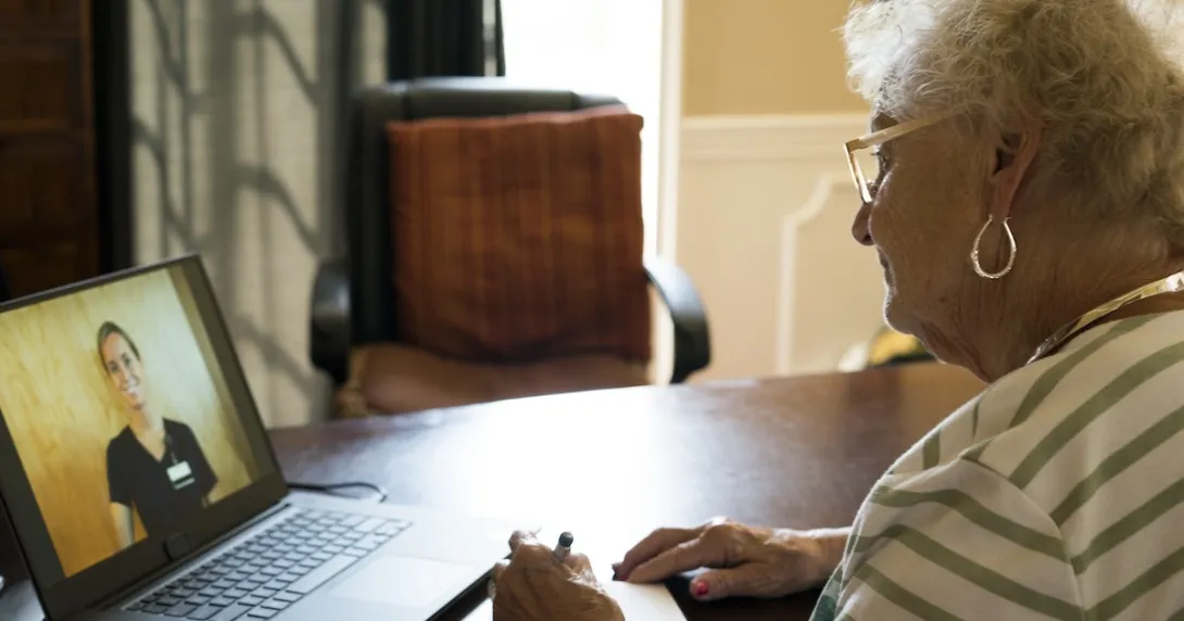 Patient consulting with healthcare practitioner via laptop computer Patient consulting with healthcare practitioner via laptop computer