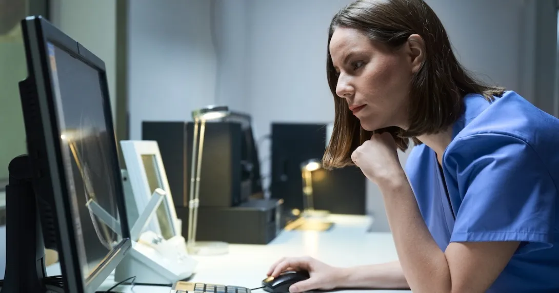 Technician reviewing MRI data Technician reviewing MRI data