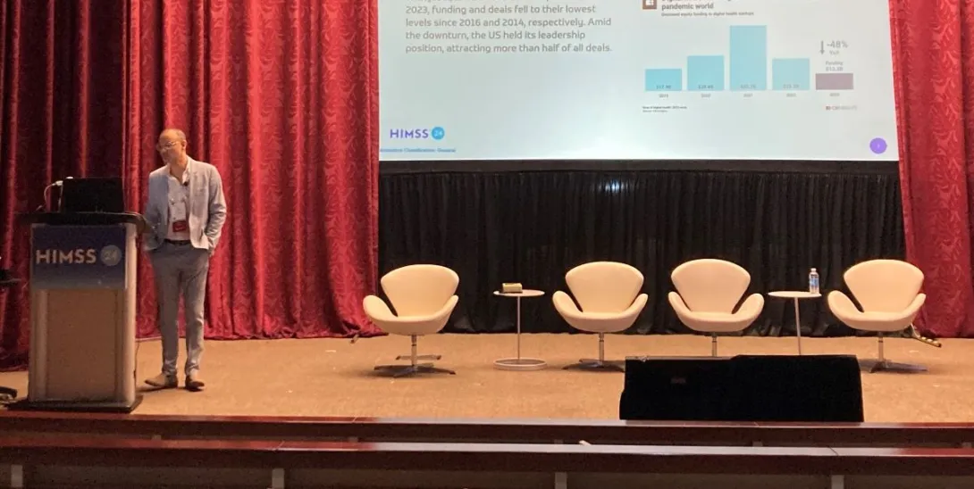 person presenting on stage person presenting on stage