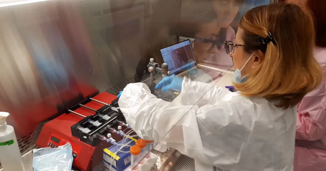 Researcher at the Kennedy Space Center preparing the programmable syringe pumps Researcher at the Kennedy Space Center preparing the programmable syringe pumps