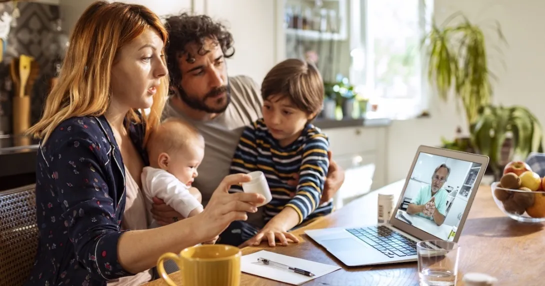 Family communicating with healthcare professional via telehealth Family communicating with healthcare professional via telehealth