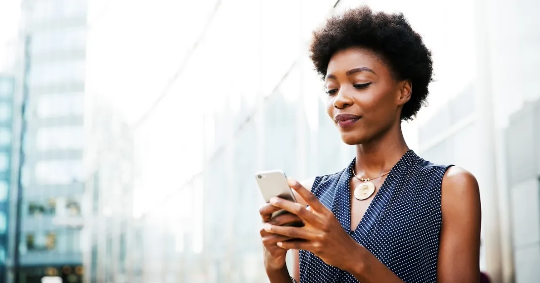 Person looking at information via a mobile app Person looking at information via a mobile app