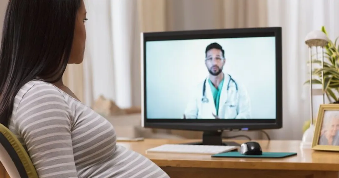 Pregnant person conferring remotely with a healthcare professional Pregnant person conferring remotely with a healthcare professional
