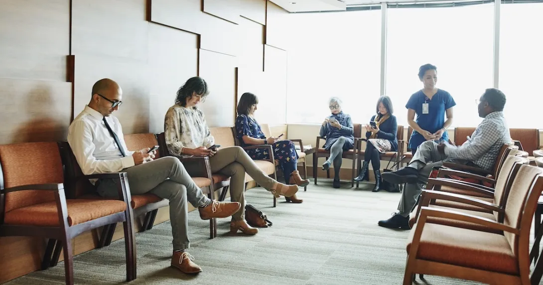 Patients sitting in a physician waiting room Patients sitting in a physician waiting room