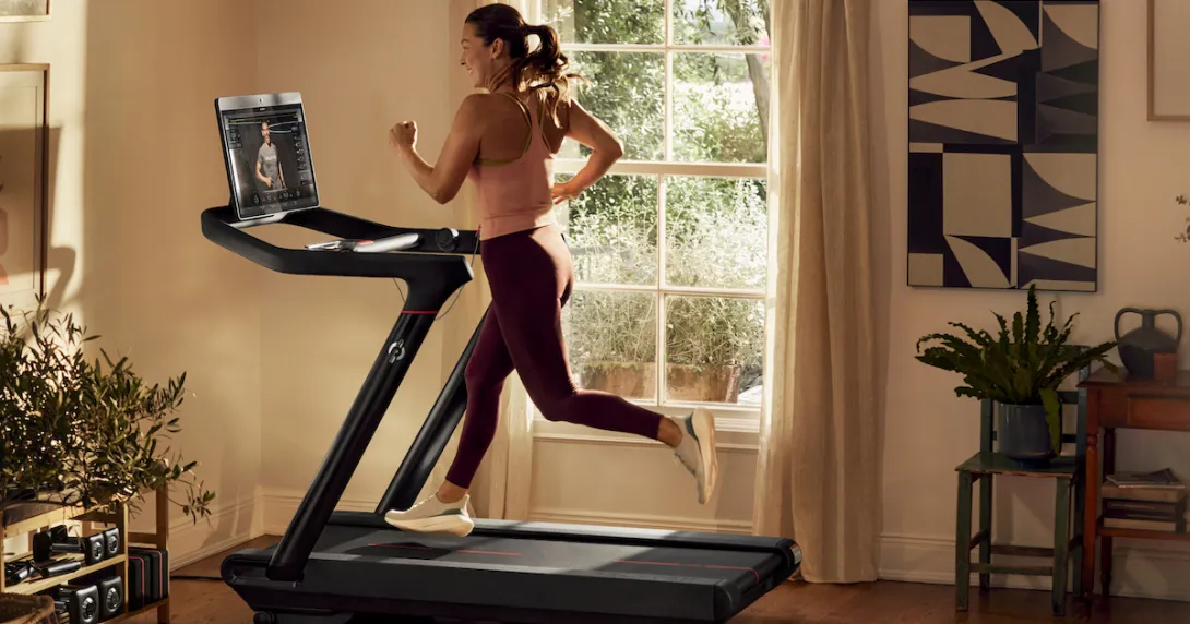 A person exercising on a Peloton treadmill A person exercising on a Peloton treadmill