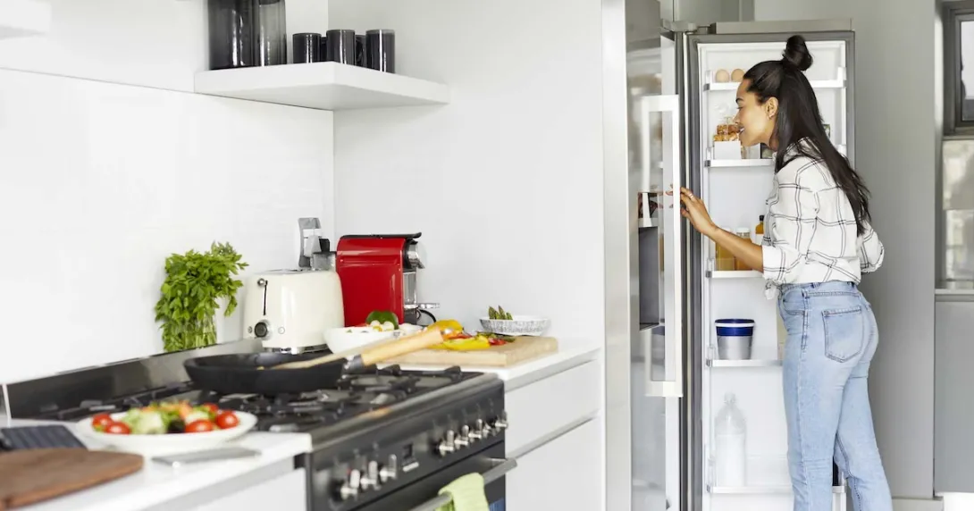 Person looking in a refrigerator Person looking in a refrigerator
