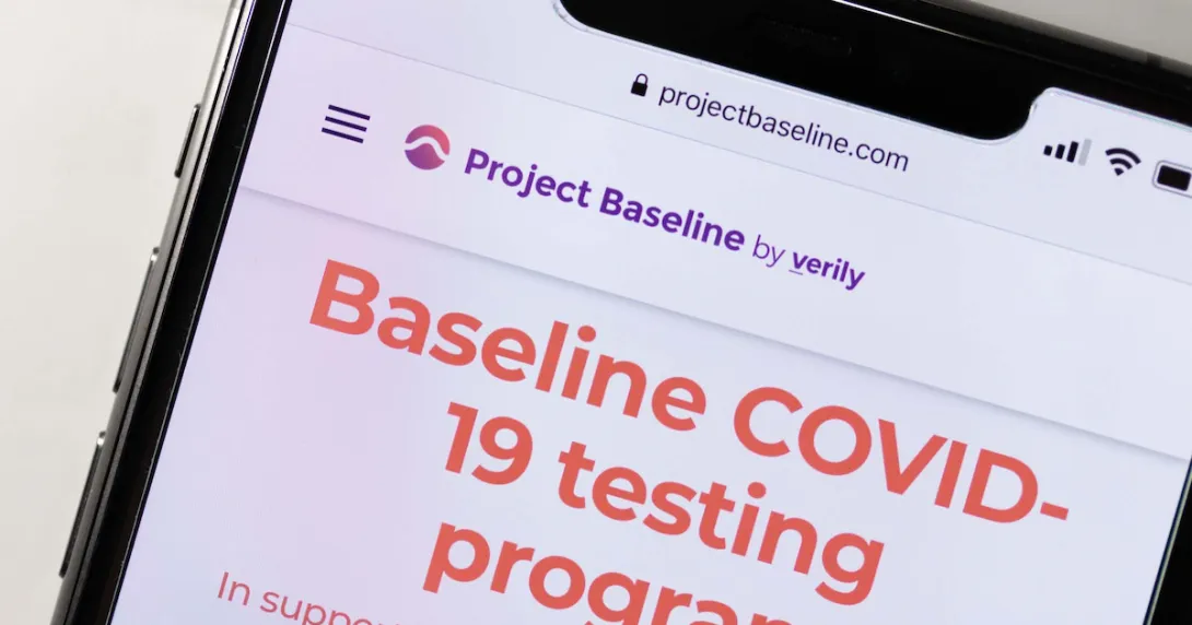 A phone showing a screenshot from Project Baseline's COVID-19 testing program. A phone showing a screenshot from Project Baseline's COVID-19 testing program.
