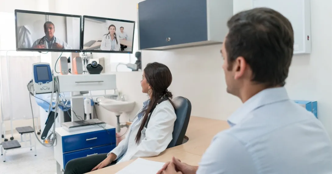 Clinicians interacting via interactive TV screens Clinicians interacting via interactive TV screens