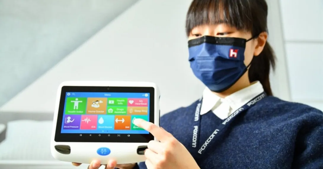 A staff from Foxconn demonstrating a digital medical device