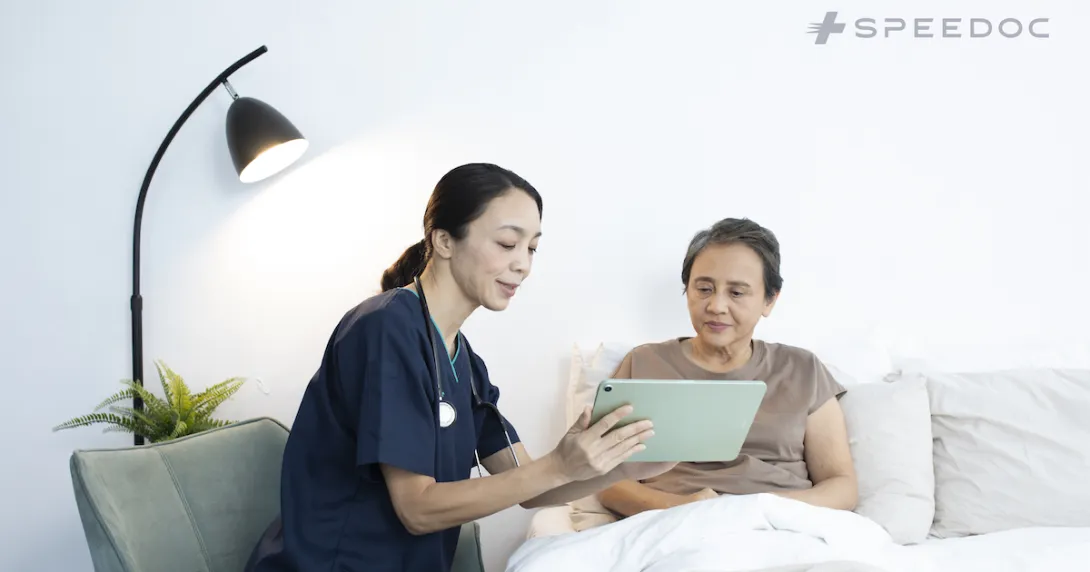 A Speedoc nurse assisting an elderly patient at home