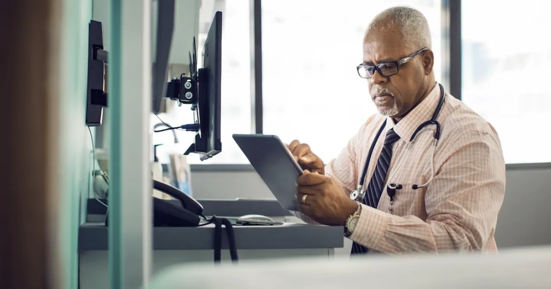 Healthcare professional with a tablet Healthcare professional with a tablet
