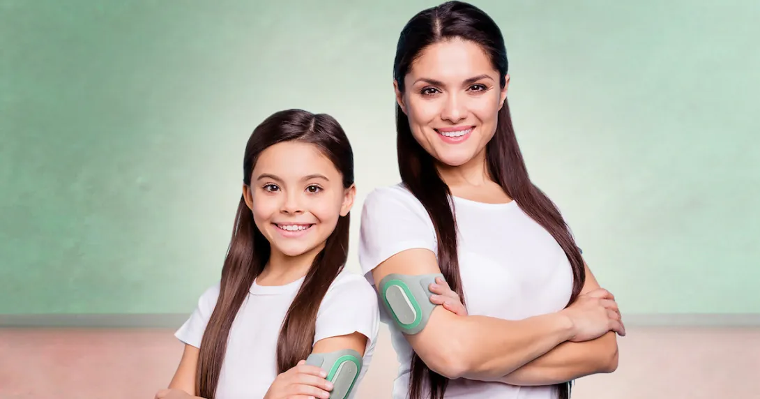 An adult and child wearing the Nerivio device. An adult and child wearing the Nerivio device.