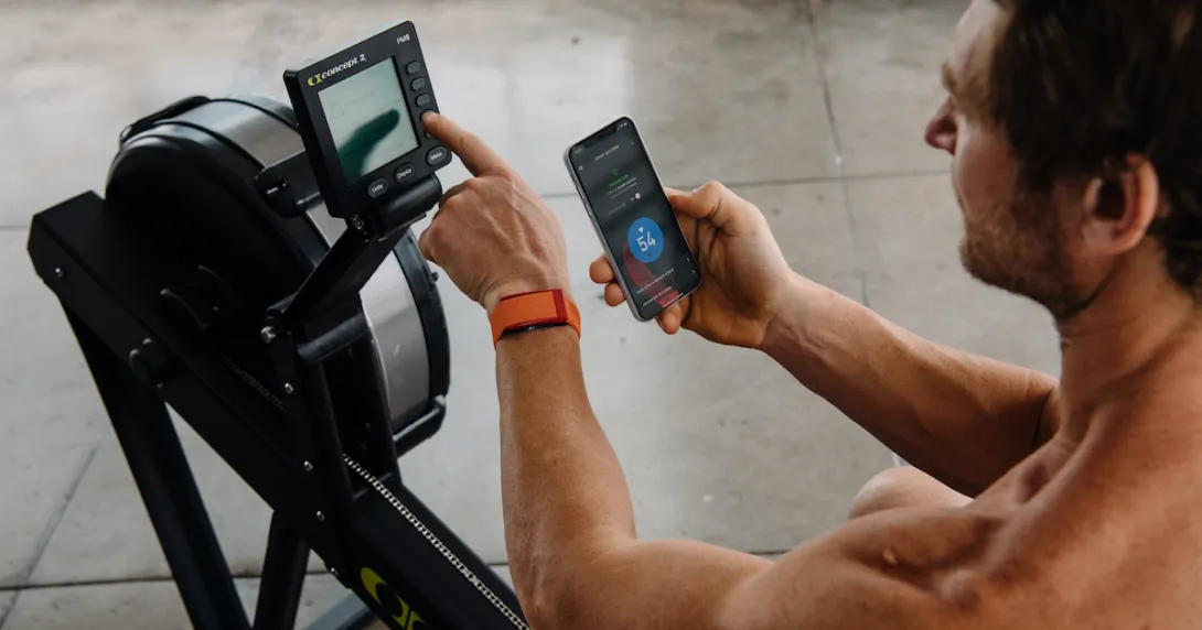 WHOOP user checking app before rowing workout